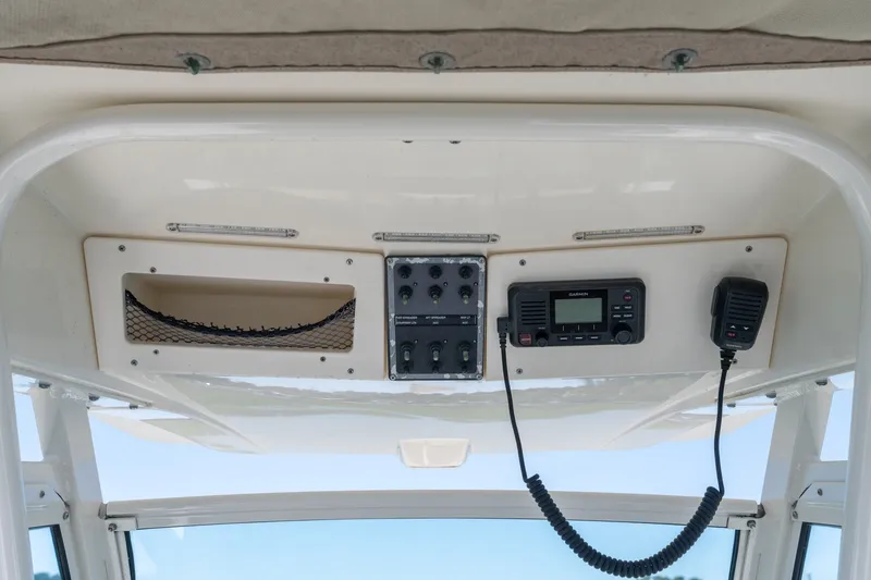 Slide: The Image of 2019 Scout 251 XSS boat dashboard with radio and control panel. - 20