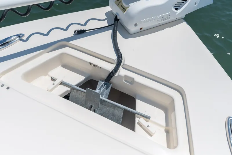 Slide: The Image of Anchor compartment on 2019 Scout 251 XSS boat with Minn Kota trolling motor. - 24