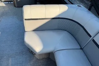 Slide: The Image of 2023 Angler Qwest 22' Pro Family Fish boat with cushioned seating. - 16