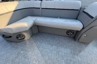 Slide: The Image of 2023 Angler Qwest 22' Pro Family Fish boat seating with integrated speakers. - 22