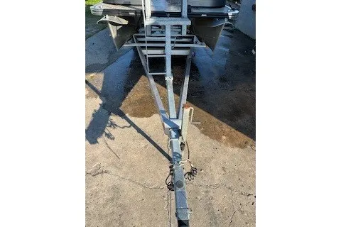 Slide: The Image of Trailer hitch of 2023 Angler Qwest 22' Pro Family Fish boat on concrete surface. - 5