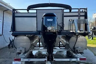Slide: The Image of 2023 Angler Qwest 22' Pro Family Fish pontoon boat with 30 HP engine. - 2