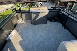 Slide: The Image of 2023 Angler Qwest 22' Pro Family Fish boat interior with spacious deck and seating. - 25