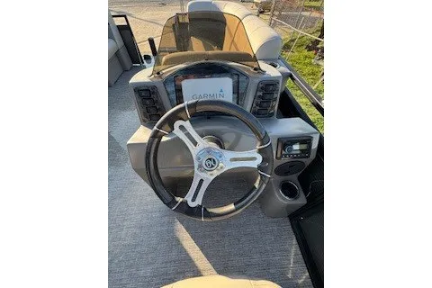 Slide: The Image of 2023 Angler Qwest 22' Pro Family Fish boat dashboard with Garmin navigation system. - 18