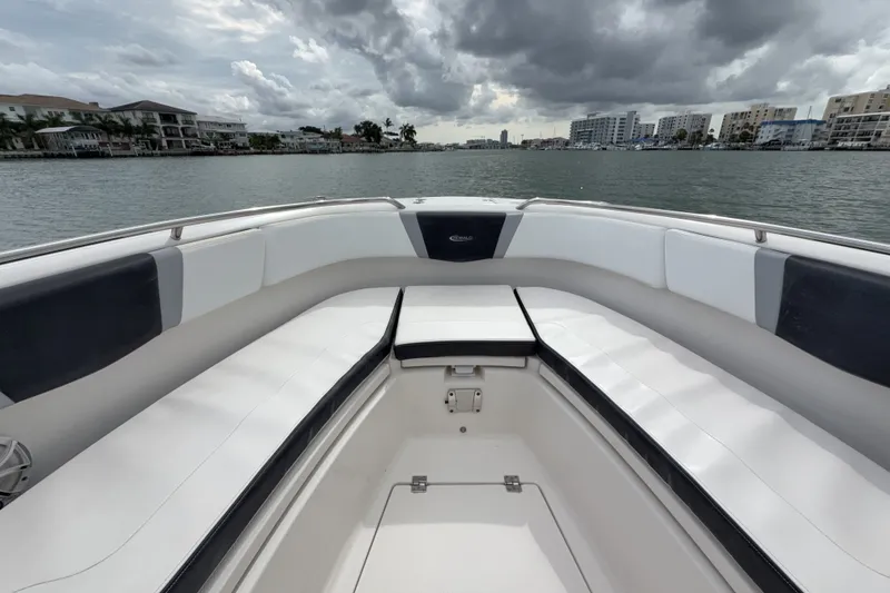 Slide: The Image of 2019 Robalo R272 Center Console boat interior with waterfront view. - 18