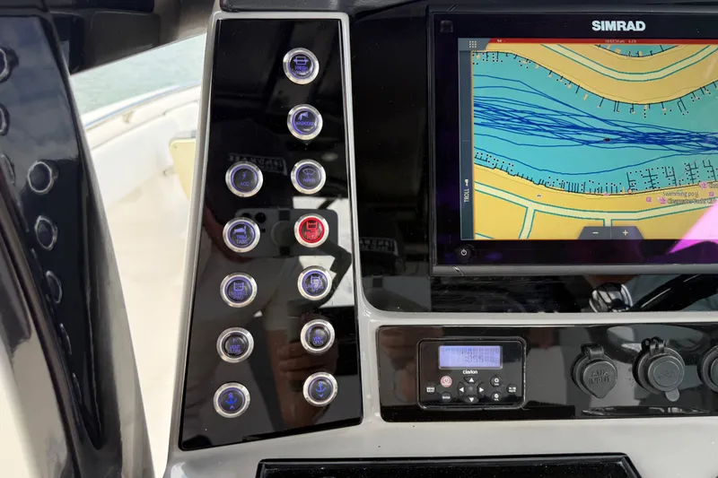 Slide: The Image of Control panel of 2019 Robalo R272 Center Console with Simrad navigation display. - 23