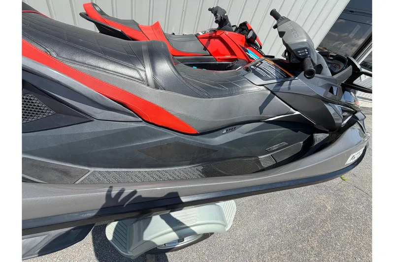 Slide: The Image of 2014 Sea-Doo GTX Limited iS 260 jet ski with sleek black and red design. - 7