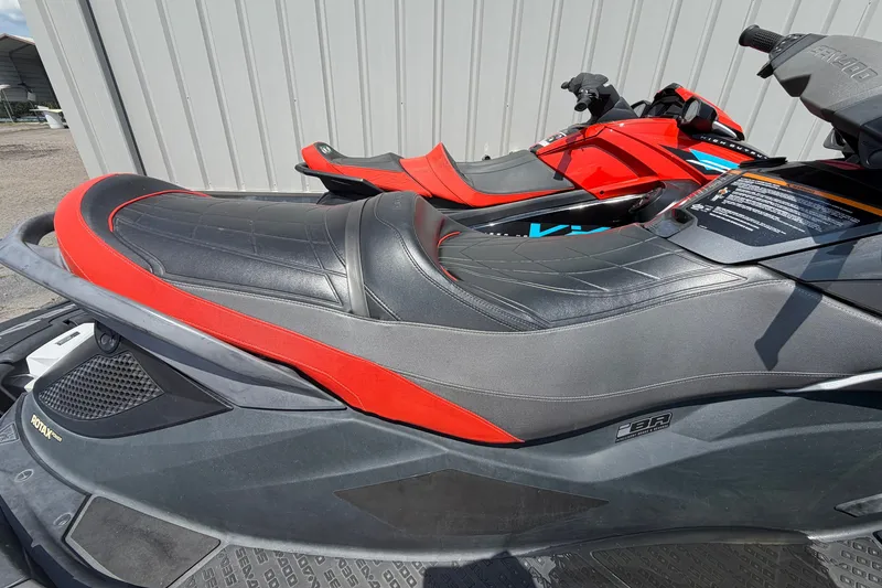 Slide: The Image of 2014 Sea-Doo GTX Limited iS 260 jet ski with red and black seat design. - 4