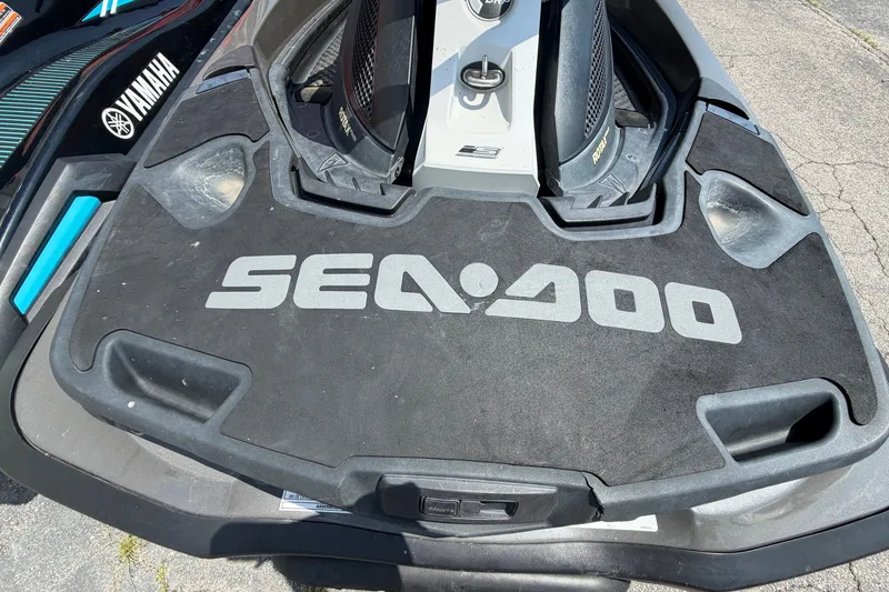 Slide: The Image of 2014 Sea-Doo GTX Limited iS 260 jet ski rear deck with logo, parked on pavement. - 9