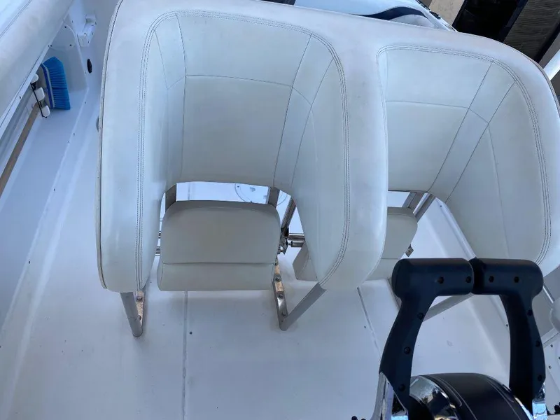 Slide: The Image of Wellcraft 302 Sport 1999 boat interior with white leather seats. - 8