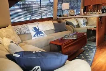 Slide: The Image of Luxurious interior of a 1996 Ocean 53 Super Sport yacht with elegant seating and decor. - 3