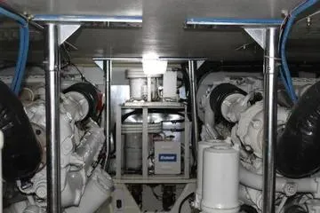 Slide: The Image of Engine room of 1996 Ocean 53 Super Sport yacht, showcasing dual engines and equipment. - 16