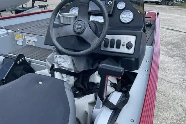 Slide: The Image of 2020 Crestliner 1700 Storm boat interior with steering wheel and control panel. - 2