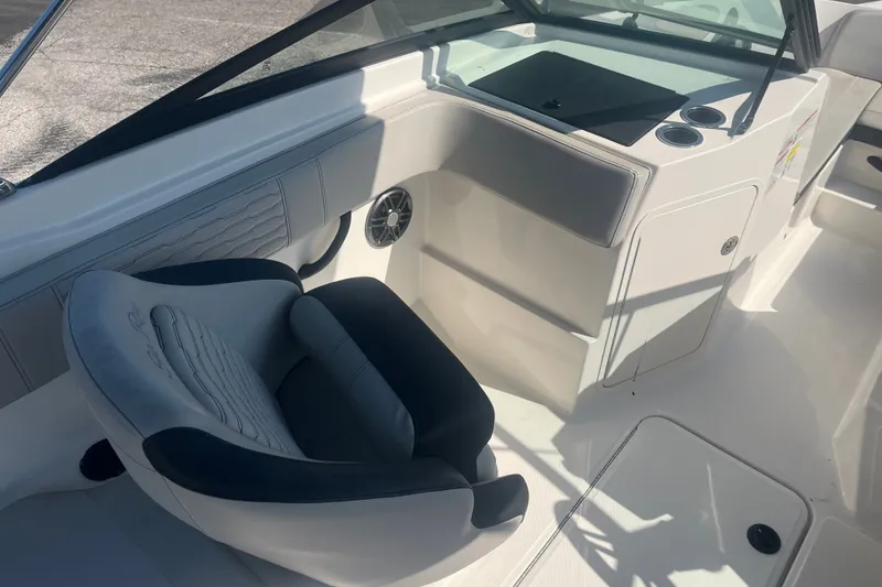 The Image of 2023 Sea Ray SPX 210 Outboard boat interior with seating and console. - 1