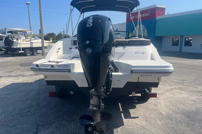 Slide: The Image of 2023 Sea Ray SPX 210 Outboard boat with powerful engine, parked outdoors. - 10