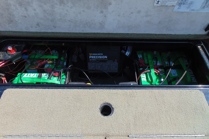 Slide: The Image of Battery compartment of a 2016 Ranger Z521L boat with Minn Kota Precision charger. - 12