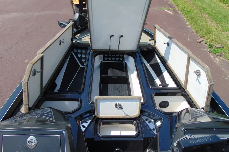 Slide: The Image of 2016 Ranger Z521L boat storage compartments open, showcasing ample space and organization. - 8