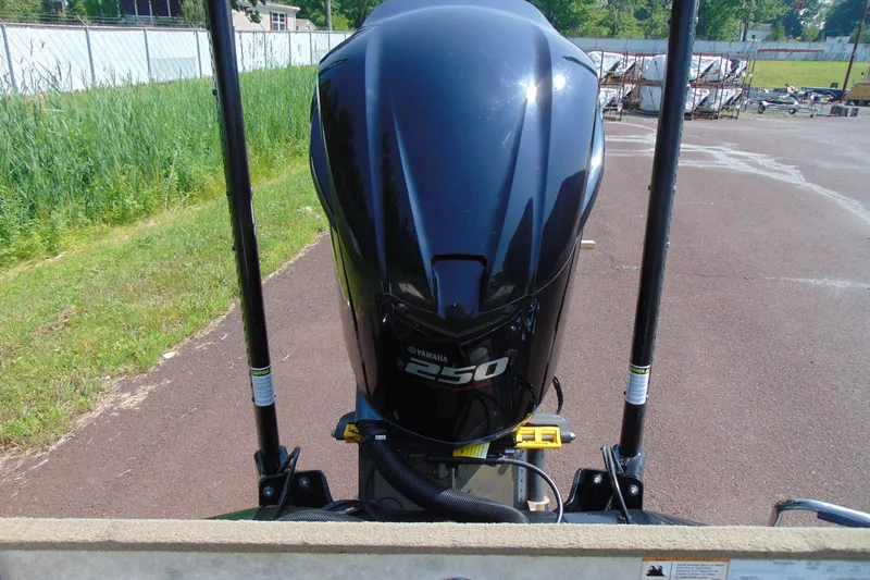 Slide: The Image of 2016 Ranger Z521L boat with Yamaha 250 outboard motor in a parking area. - 13