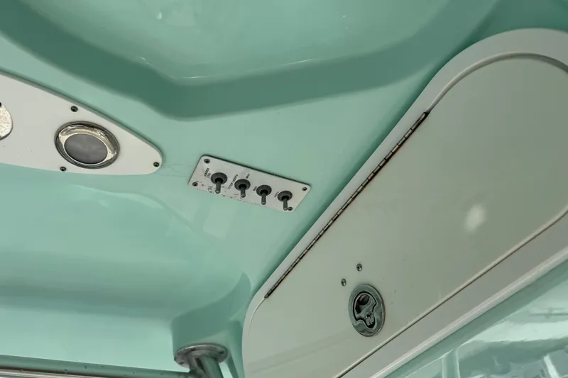 Slide: The Image of Interior view of a 2013 Sea Fox 286 Center Console boat, featuring control panel and hatch. - 27
