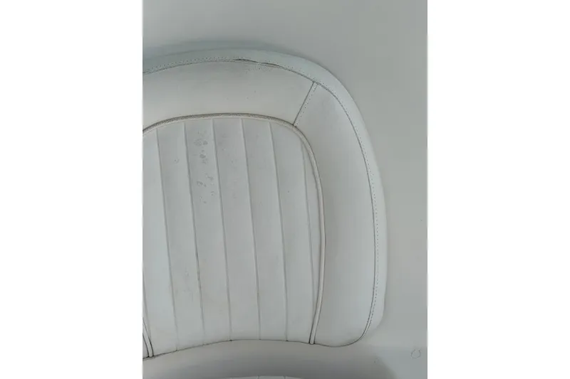 Slide: The Image of White leather seat detail from 2013 Sea Fox 286 Center Console boat. - 31