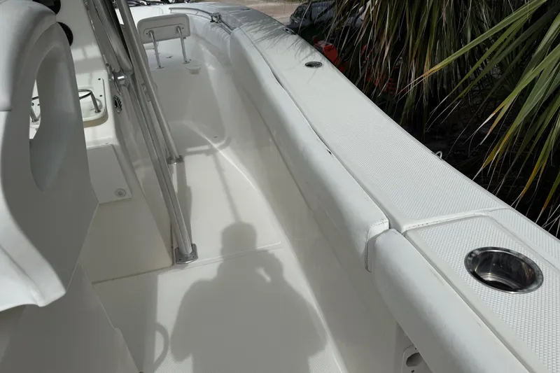 Slide: The Image of 2013 Sea Fox 286 Center Console boat interior with seating and cup holder. - 25