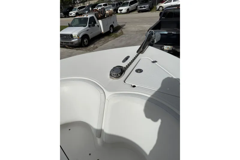 Slide: The Image of 2013 Sea Fox 286 Center Console boat deck with anchor chain and storage hatch. - 30