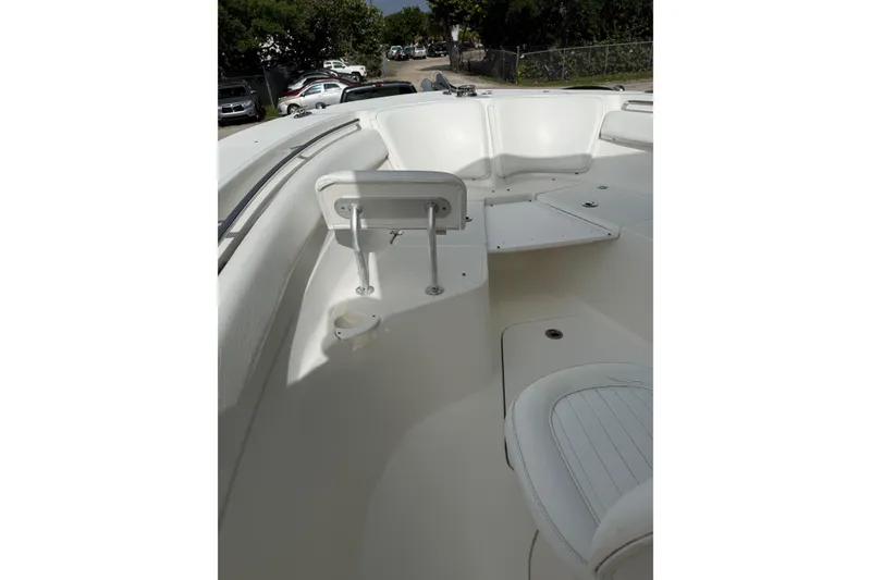 Slide: The Image of 2013 Sea Fox 286 Center Console boat interior with white seating and cup holder. - 29