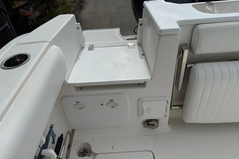Slide: The Image of 2013 Sea Fox 286 Center Console boat interior with seating and storage compartments. - 18