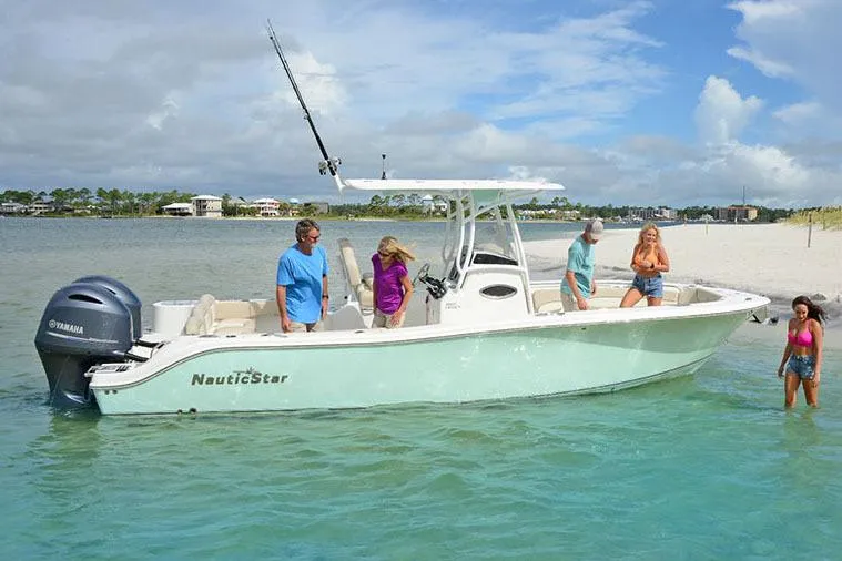 Slide: The Image of Manufacturer Provided Image: 2018 NauticStar 2602 Legacy boat with people enjoying a day at the beach. - 13