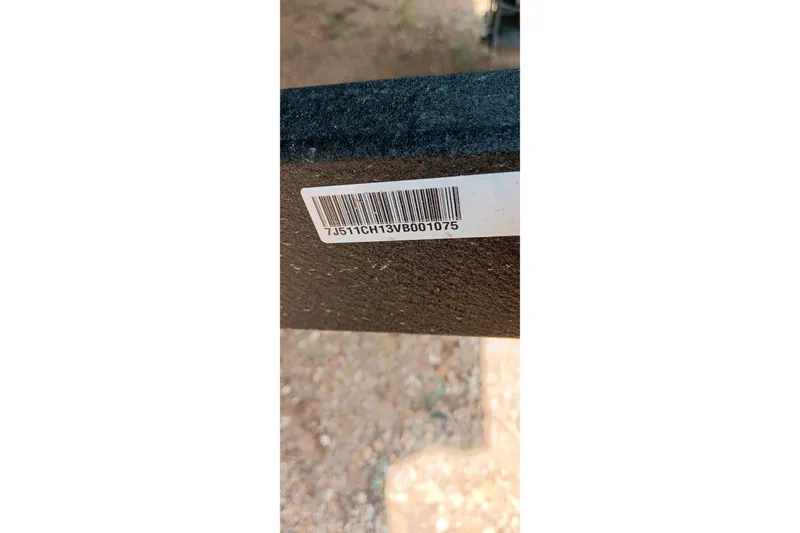 Slide: The Image of Barcode on 2027 Tracker Pro Team 175 boat component, displaying serial number. - 18