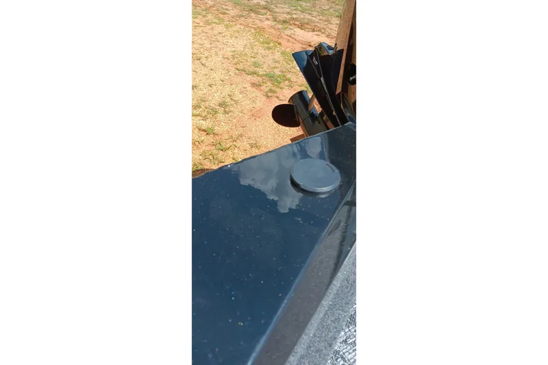 Slide: The Image of Close-up of 2027 Tracker Pro Team 175 boat detail with reflective surface. - 15