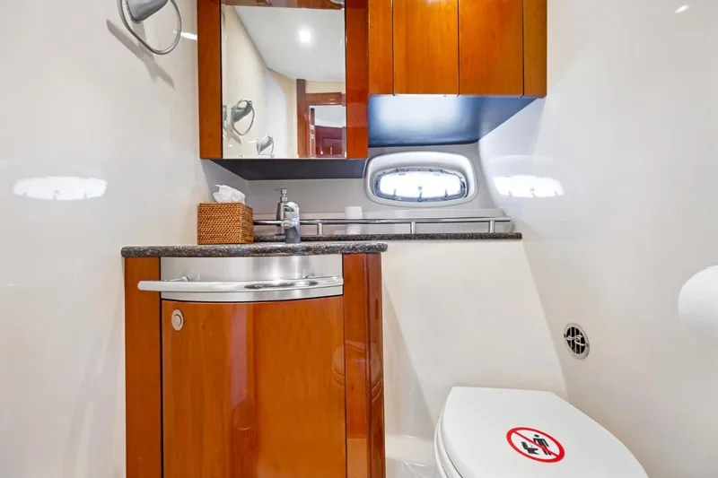 Slide: The Image of Luxurious bathroom in 2007 Sea Ray 48 Sundancer yacht with wood cabinetry and modern fixtures. - 15