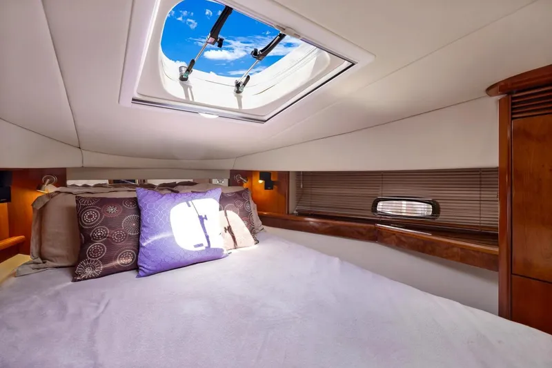 Slide: The Image of Luxurious cabin interior of 2007 Sea Ray 48 Sundancer yacht with skylight and plush bedding. - 14