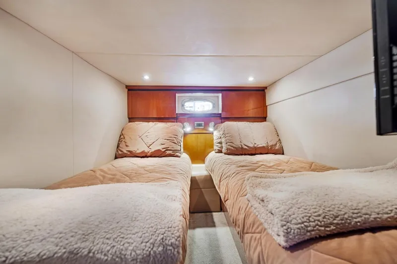 Slide: The Image of Luxurious twin cabin interior of 2007 Sea Ray 48 Sundancer yacht. - 17