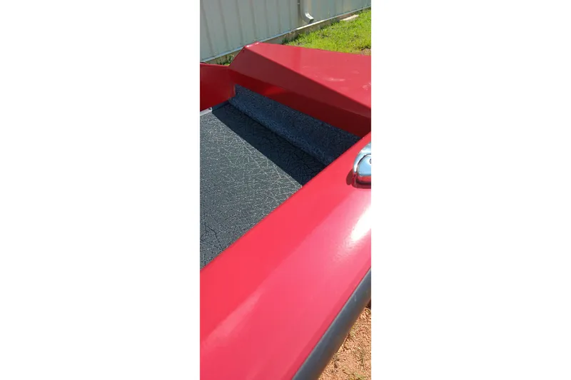 Slide: The Image of Red Tracker Pro Team 175 boat deck, 2027 model, with textured flooring. - 14
