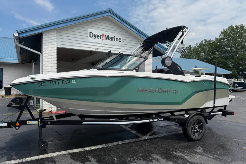 The Image of 2022 MasterCraft NXT20 boat on trailer at Dyer Marine dealership. - 1