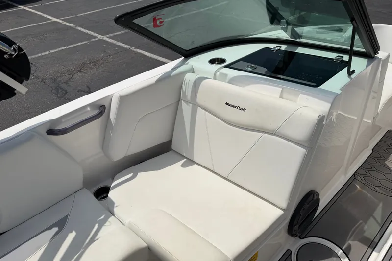 Slide: The Image of 2022 MasterCraft NXT20 boat interior with white seating and windshield. - 8