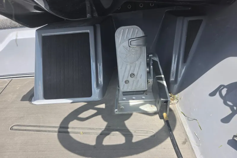 Slide: The Image of Foot pedal and steering wheel of 2023 Nitro Z21 XL boat cockpit. - 8
