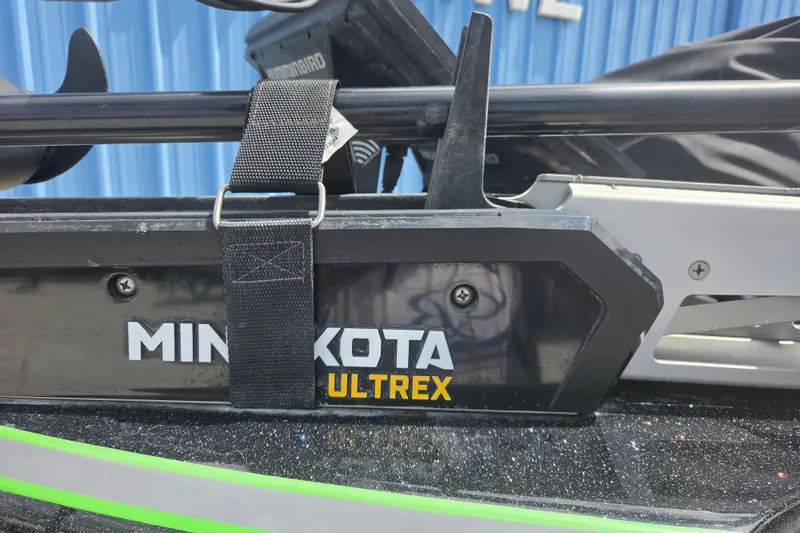 Slide: The Image of Minn Kota Ultrex motor on 2023 Nitro Z21 XL boat, secured with a strap. - 2