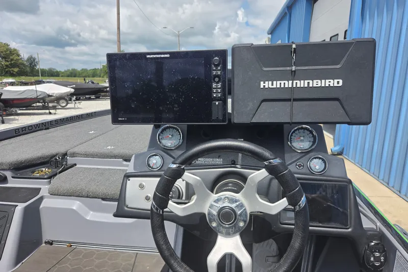 Slide: The Image of 2023 Nitro Z21 XL boat dashboard with Humminbird electronics and steering wheel. - 7