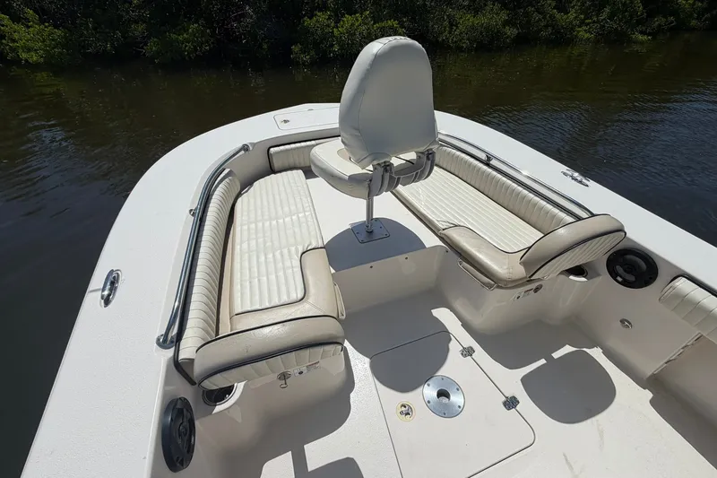 Slide: The Image of 2022 Carolina Skiff 26 Ultra Elite boat interior with cushioned seating and helm chair. - 23