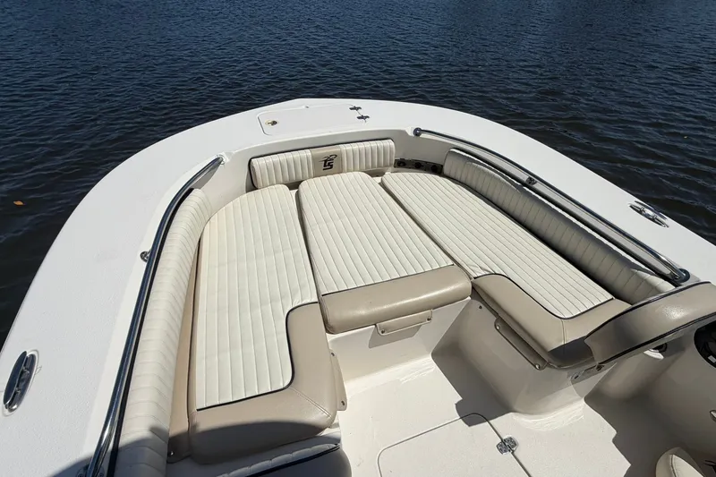 Slide: The Image of 2022 Carolina Skiff 26 Ultra Elite boat with spacious seating on calm water. - 25