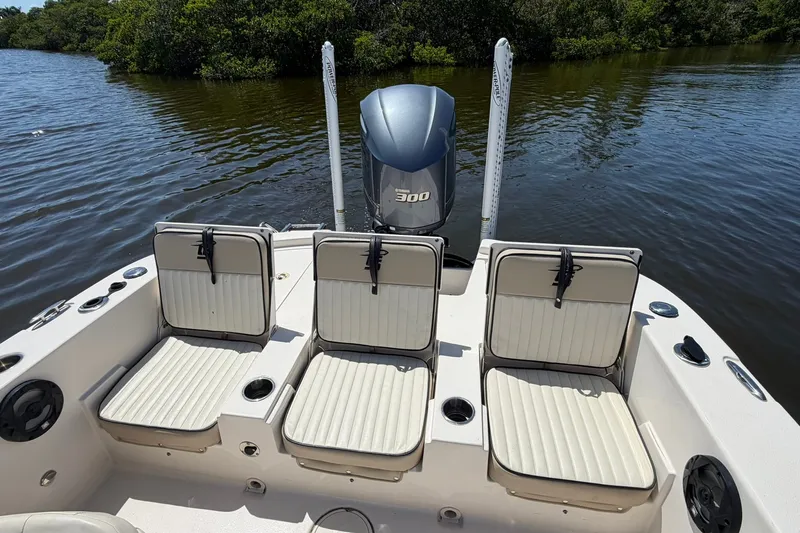 Slide: The Image of 2022 Carolina Skiff 26 Ultra Elite boat with seating and powerful outboard motor. - 13