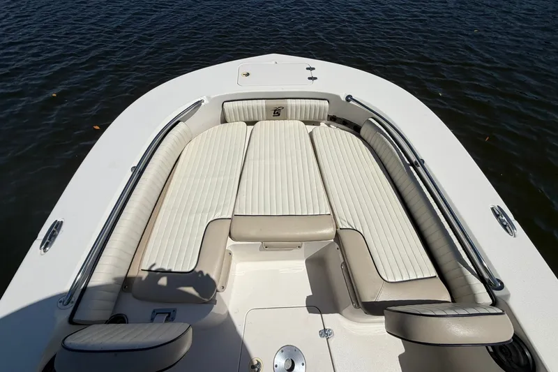 Slide: The Image of 2022 Carolina Skiff 26 Ultra Elite boat with spacious seating on calm water. - 26
