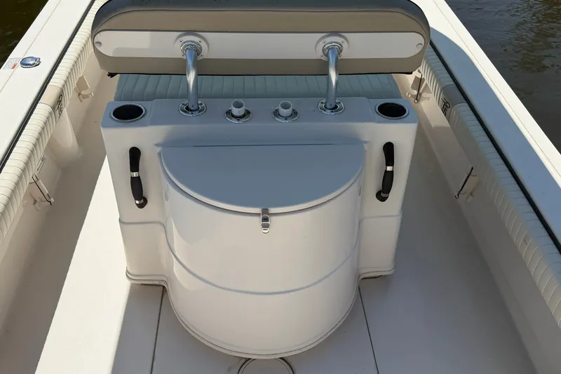 Slide: The Image of 2022 Carolina Skiff 26 Ultra Elite boat interior with seating and storage. - 15