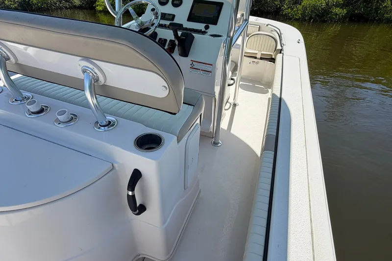 Slide: The Image of 2022 Carolina Skiff 26 Ultra Elite boat interior with helm and seating area. - 17