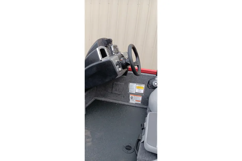 Slide: The Image of 2027 Tracker Pro Team 175 boat interior with steering wheel and control panel. - 16