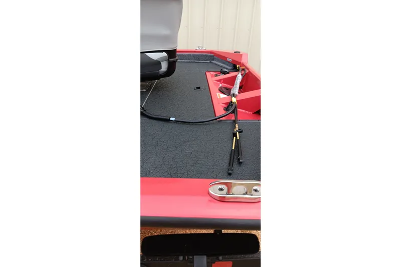Slide: The Image of 2027 Tracker Pro Team 175 boat deck with fishing rods and seating. - 17
