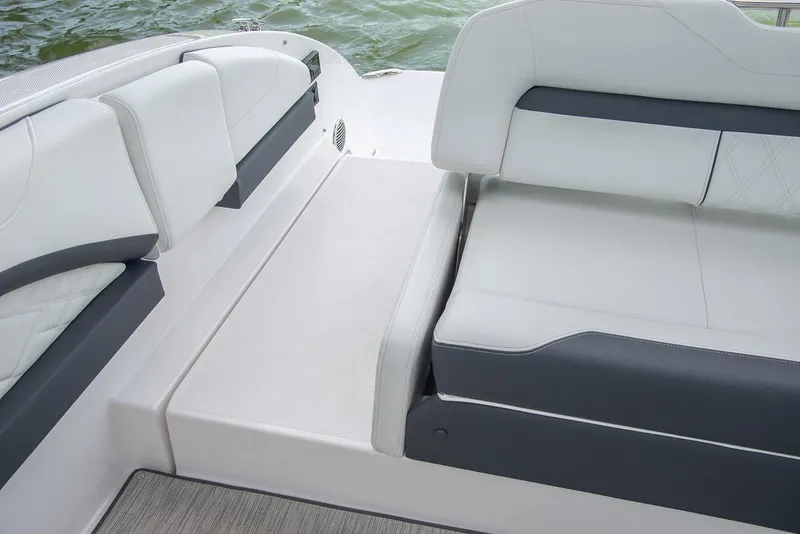 Slide: The Image of Manufacturer Provided Image: Luxury seating on 2026 Regal 3300 boat, featuring sleek white and gray upholstery. - 14