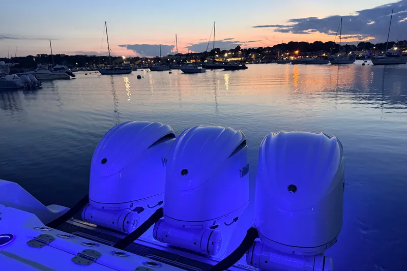 Slide: The Image of Tidewater 330 CC Adventure 2027 with triple engines at sunset marina. - 12